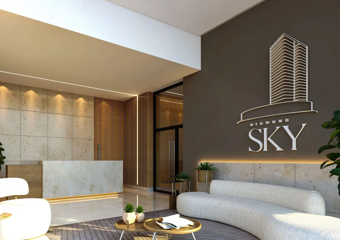 Hall de entrada do Diamond Sky, com recepção e sofá curvo